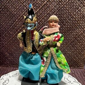 Traditional Cultural Dolls with Colorful Attire .One has the Wayang Golek mask.